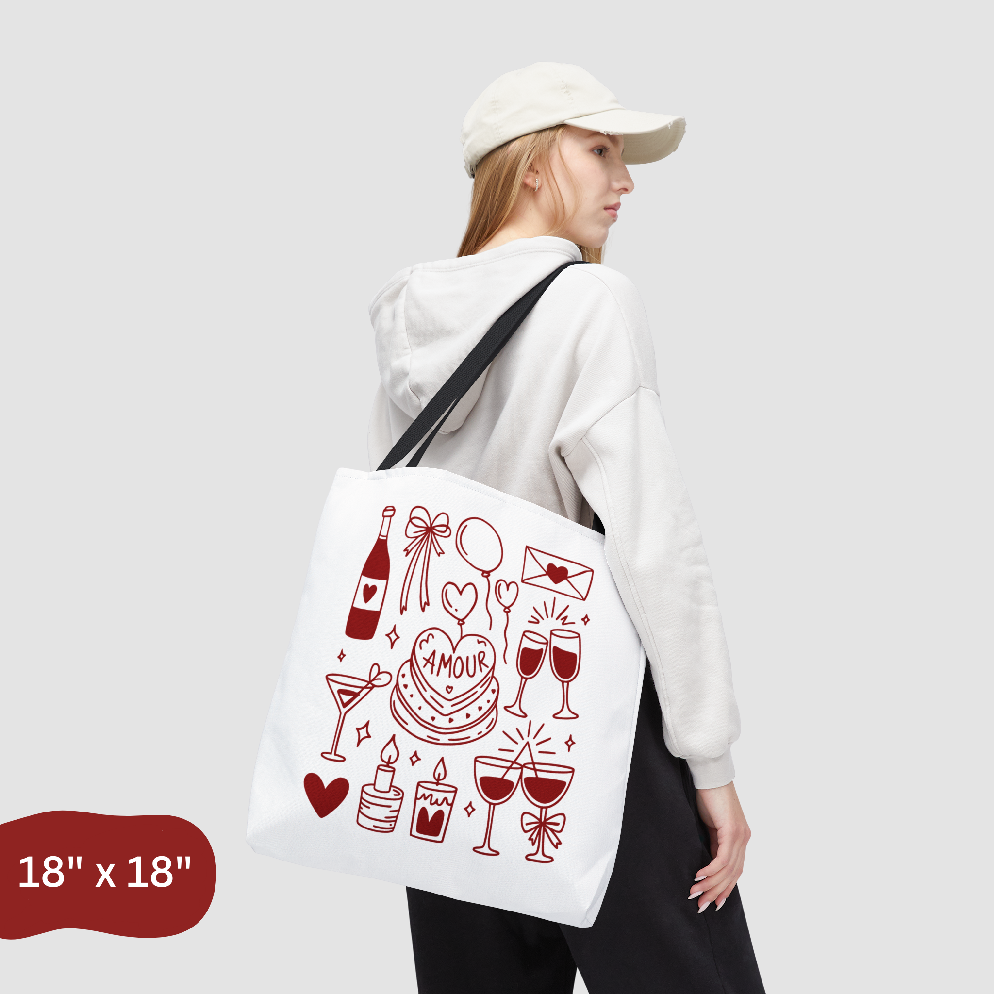 Person carrying a tote bag with red graphics on a white background
